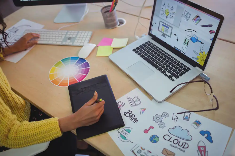 Web designer working on branding and design using a tablet